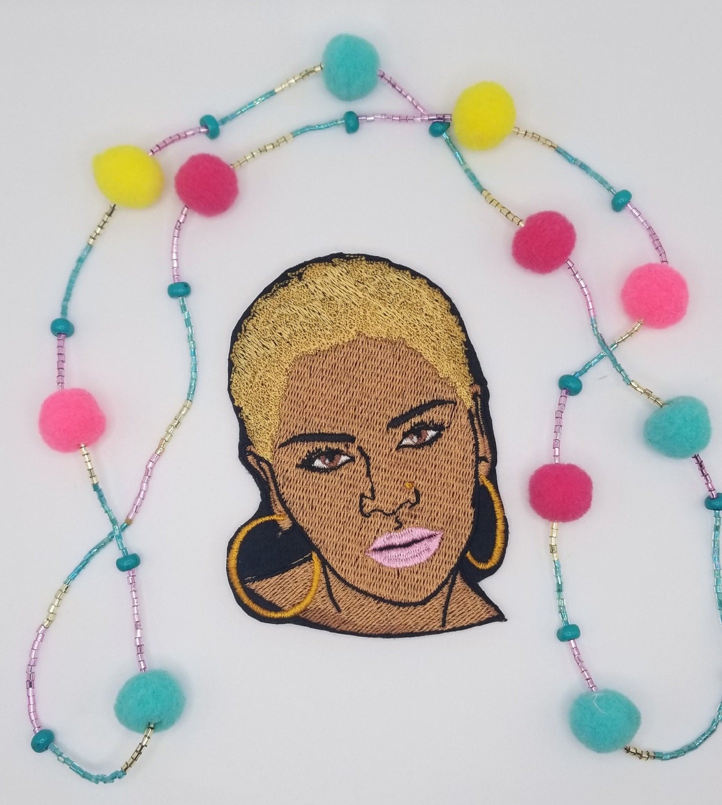 Black Woman sew on embroidery with adhesive backing. Short Afro and Nose Ring with Purple, Red and Gold Hair. Small 2 3/4" X 3 7/8"...8.00