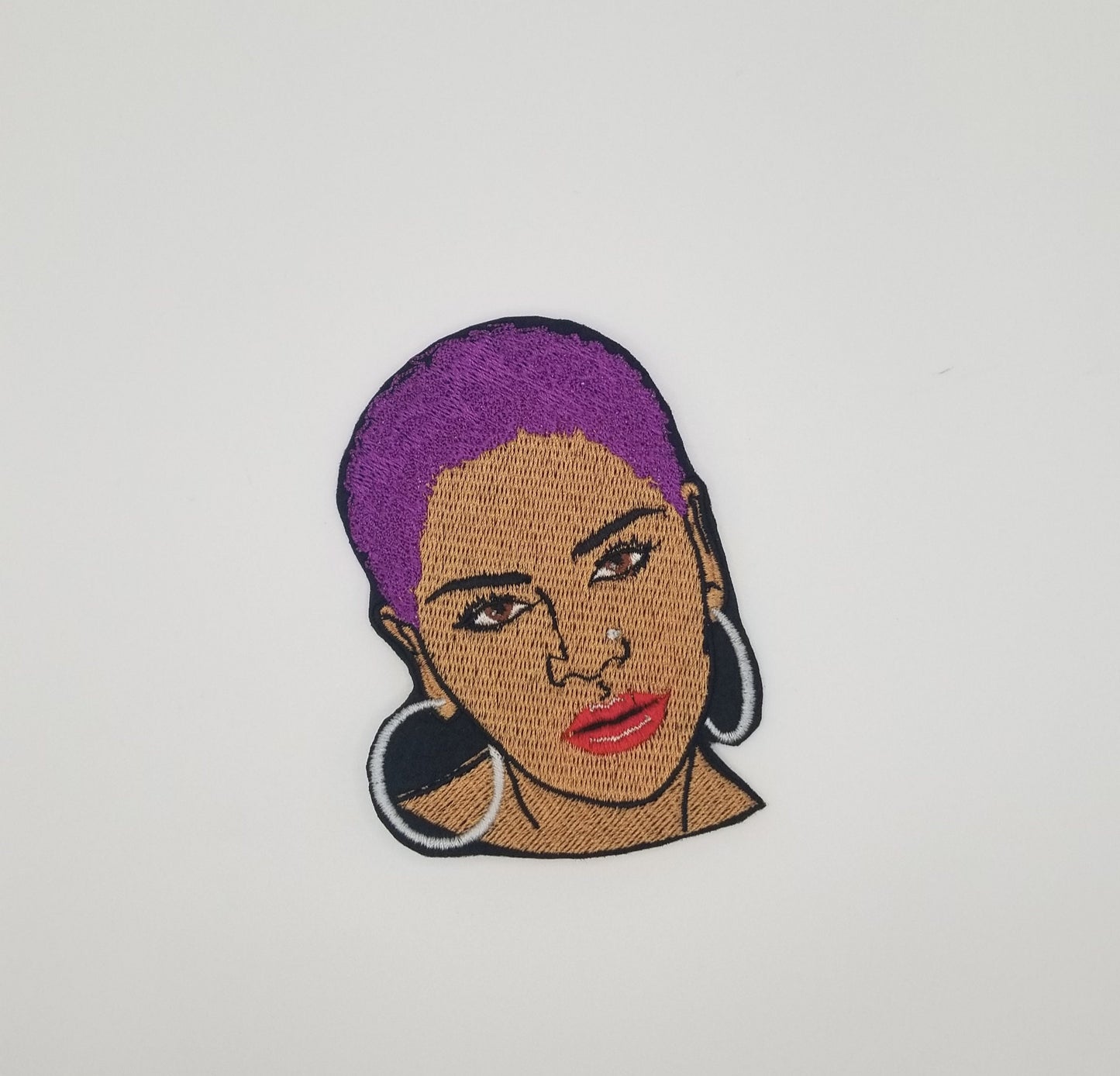 Black Woman sew on embroidery with adhesive backing. Short Afro and Nose Ring with Purple, Red and Gold Hair. Small 2 3/4" X 3 7/8"...8.00