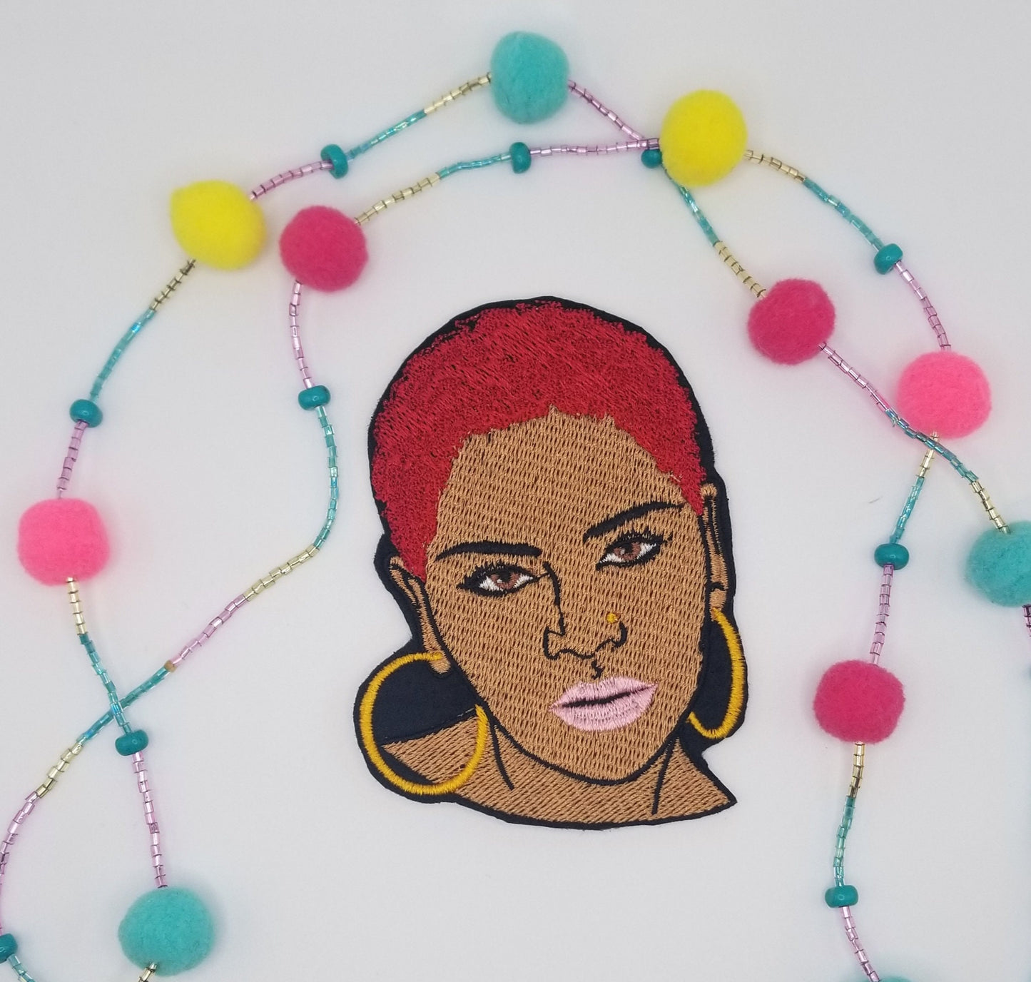 Black Woman sew on embroidery with adhesive backing. Short Afro and Nose Ring with Purple, Red and Gold Hair. Small 2 3/4" X 3 7/8"...8.00