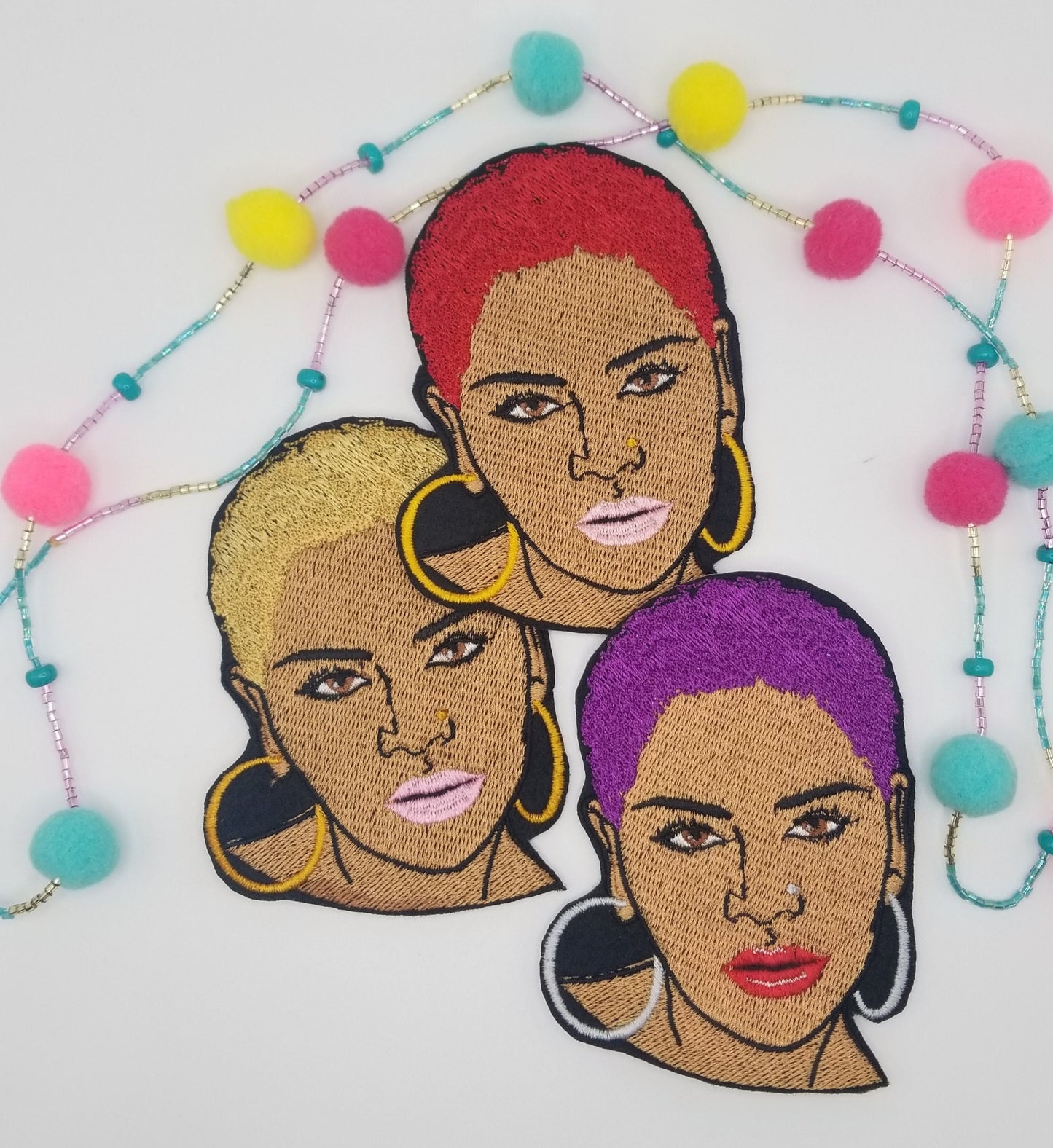 Black Woman sew on embroidery with adhesive backing. Short Afro and Nose Ring with Purple, Red and Gold Hair. Small 2 3/4" X 3 7/8"...8.00
