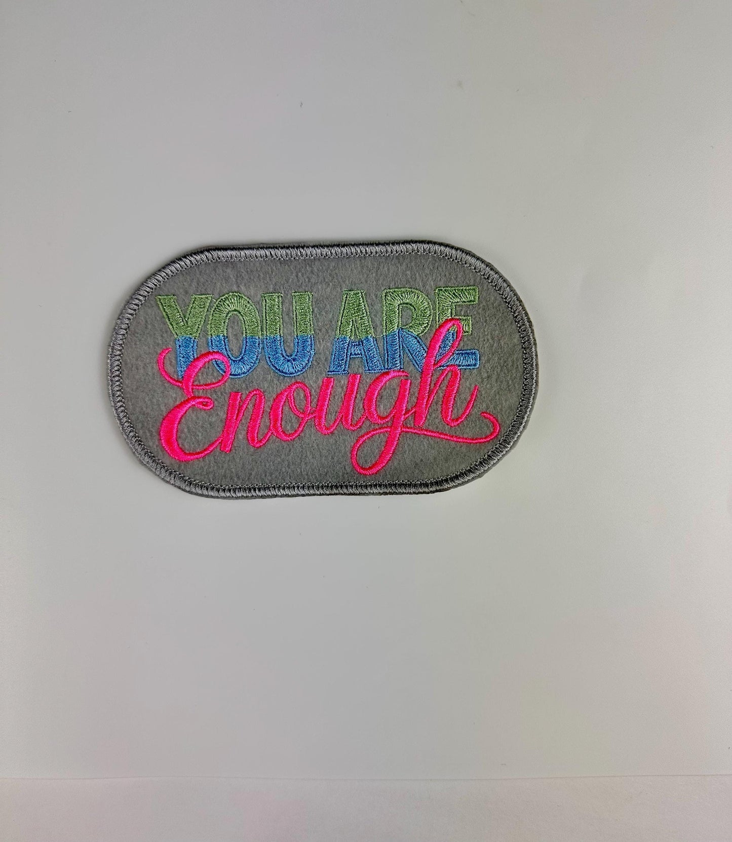 You are ENOUGH Embroidery Patch. Oval with gray background. This is a Sew On Patch with adhesive packing says it All. 7.83