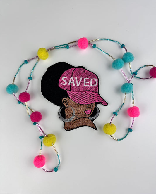 Afro Woman "SAVED" Sew on Patch with Iron on backing, wearing a Ball Cap with saved on the Cap and wearing Earrings...."9.97