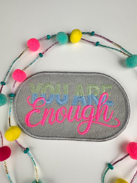You are ENOUGH Embroidery Patch. Oval with gray background. This is a  Sew On Patch with adhesive packing says it All.  7.83
