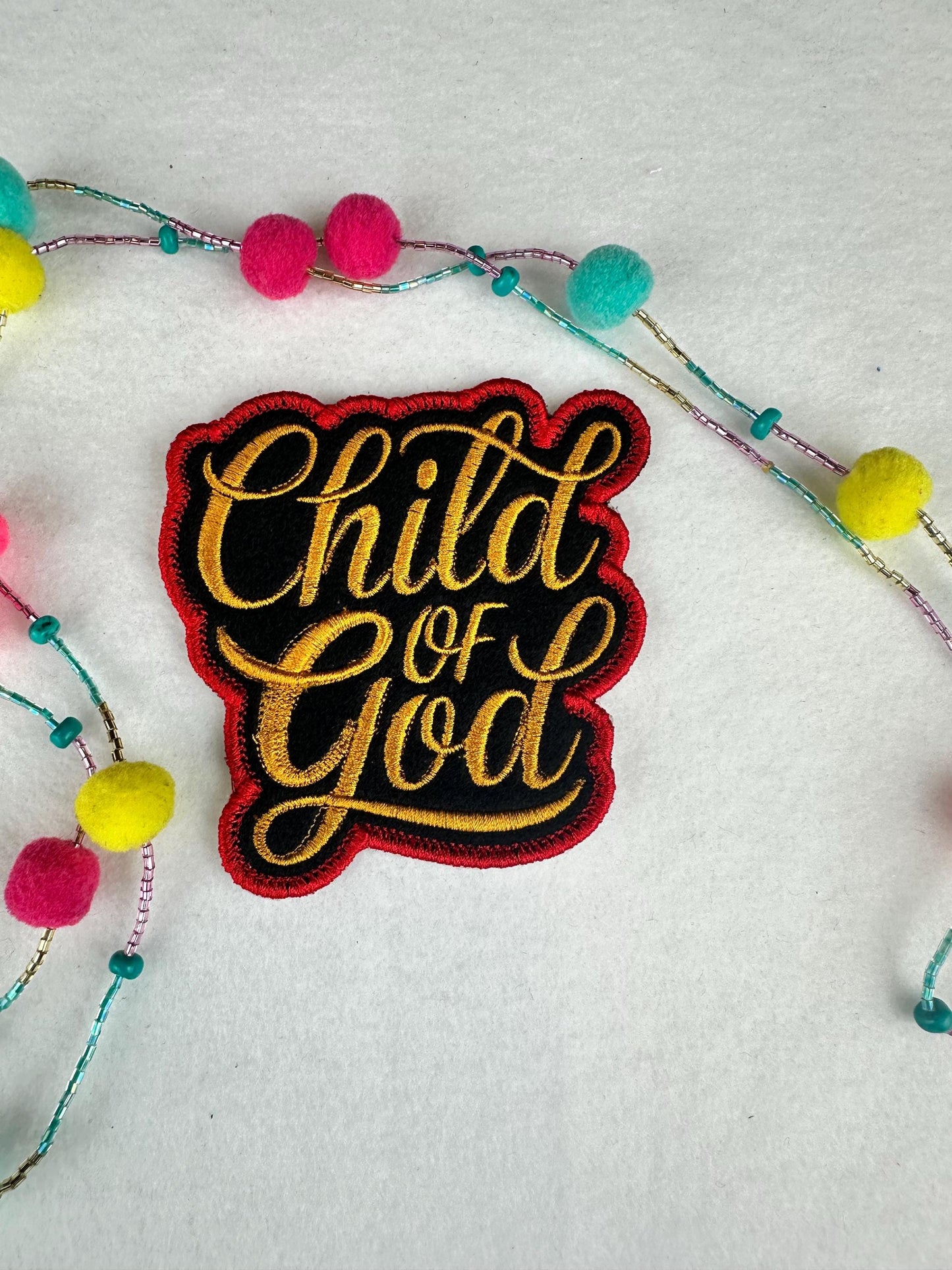 Child of God Embroidery Patch, Gold Lettering on Black with Red Border, Christian Sew On Patch with Adhesive for Placement, Jackets & Bags